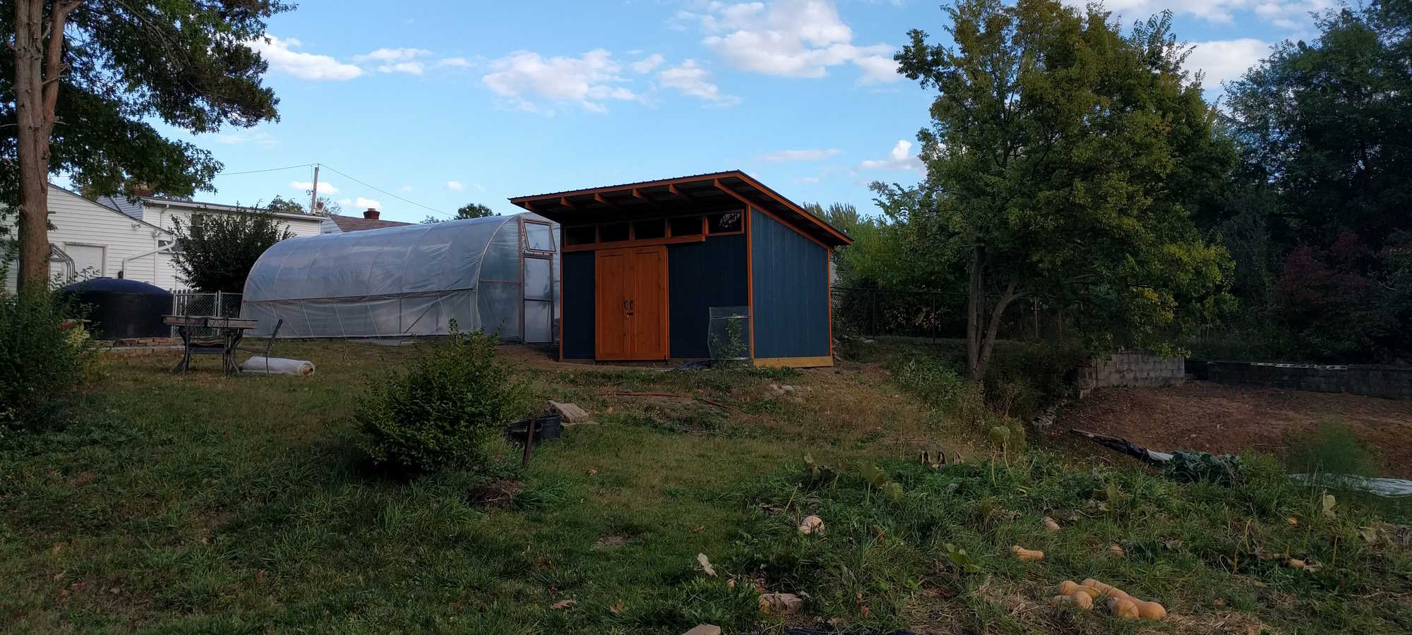 The small high tunnel and tool shed